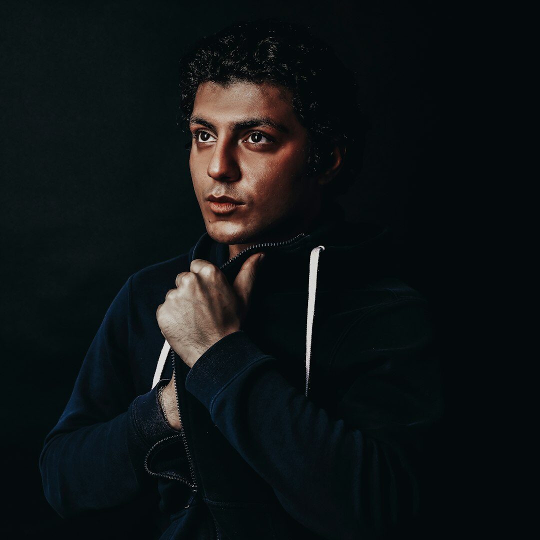 Portrait of a young man with short curly hair